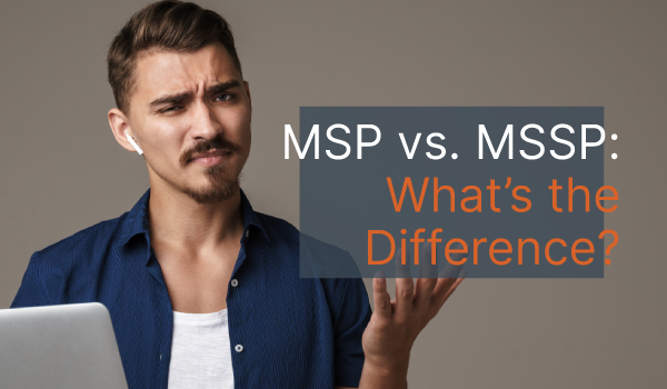 A man sitting in front of a laptop wearing a confused look on his face with his hand up. Over his hand are the words, "MSP vs. MSSP: What's the Difference?"