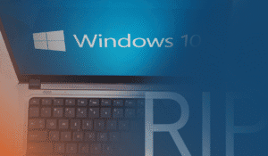 An image representing the topic of the blog "Windows 10 End of Life Is Coming. Here’s How Managed IT Services Can Help." There is a photo of a laptop with the Windows 10 logo, and the text "RIP."