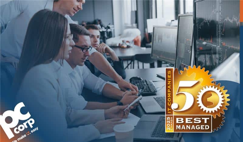 An image representing the theme of the blog, which is discussing the business benefits to customers of a managed IT service provider in Calgary who won an award. There is a photo of group of people in casual business attire huddled around a computer, looking at the screen in a bright and sunny office. In the bottom right corner, there is a digital badge for the award that says 50 Best Managed IT Companies in 2025.
