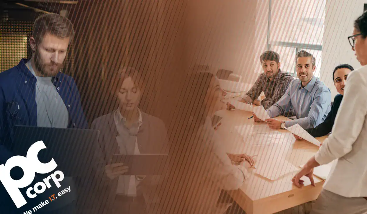 An image that represents the blog title: Who Actually Owns the Budget for Technology Purchases? There is a group of people gathered around a conference table, clearly in a spirited discussion.