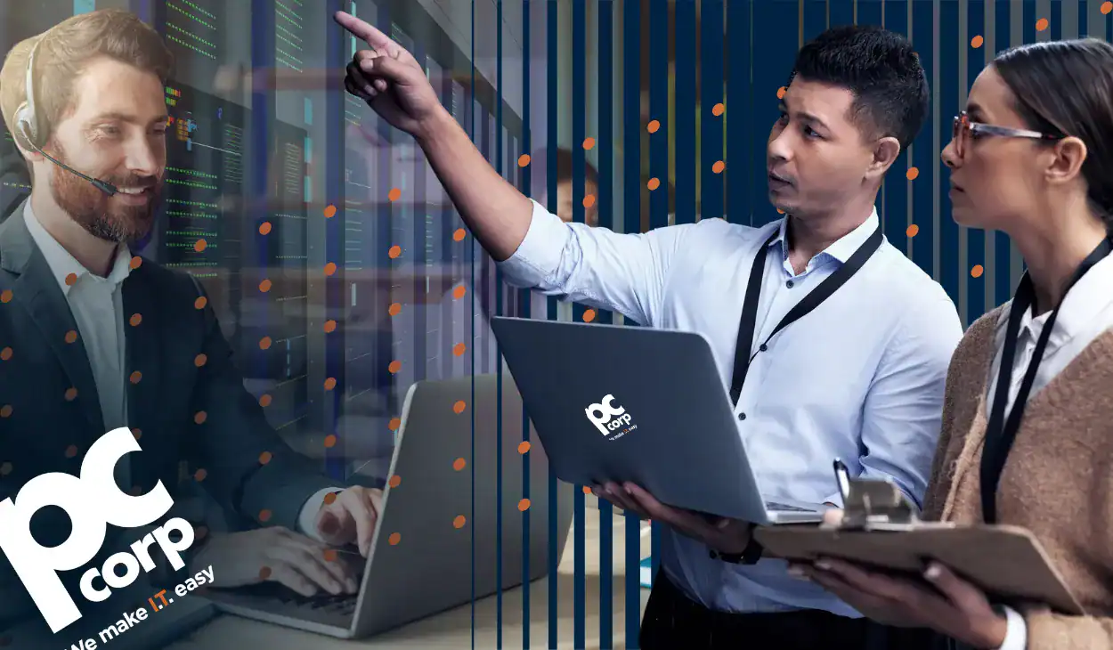An image meant to represent the title of the blog: How Do I Know What Kind of IT Procurement Support I Actually Need? There are three people wearing business casual clothing. One man is holding a laptop and pointing in the distance.
